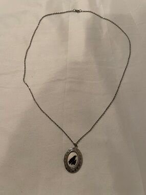 Silver chain necklace with crow locket